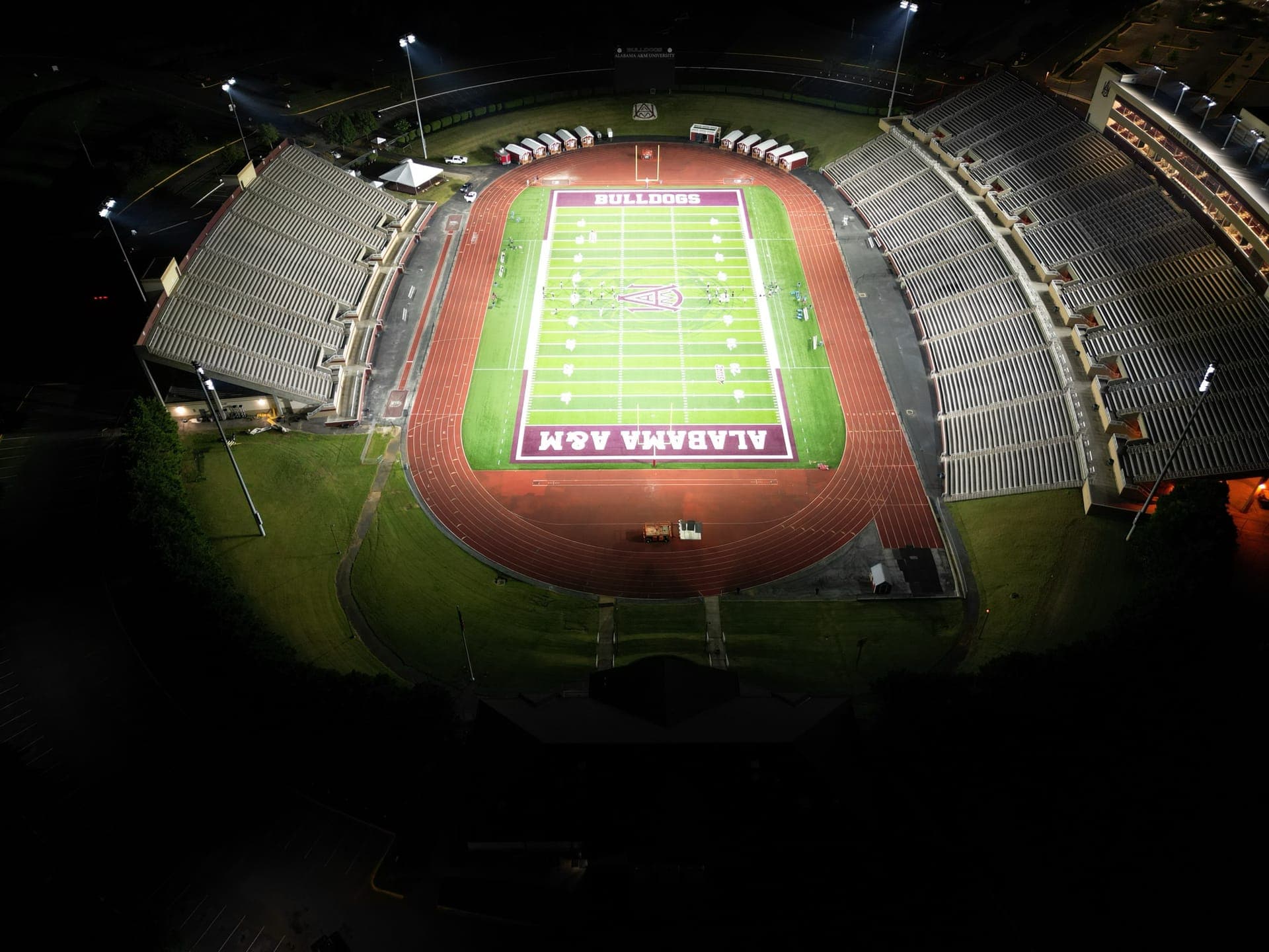 Alabama A&M's stadium at night from above, the field lit evenly after an LED sports lighting retrofit